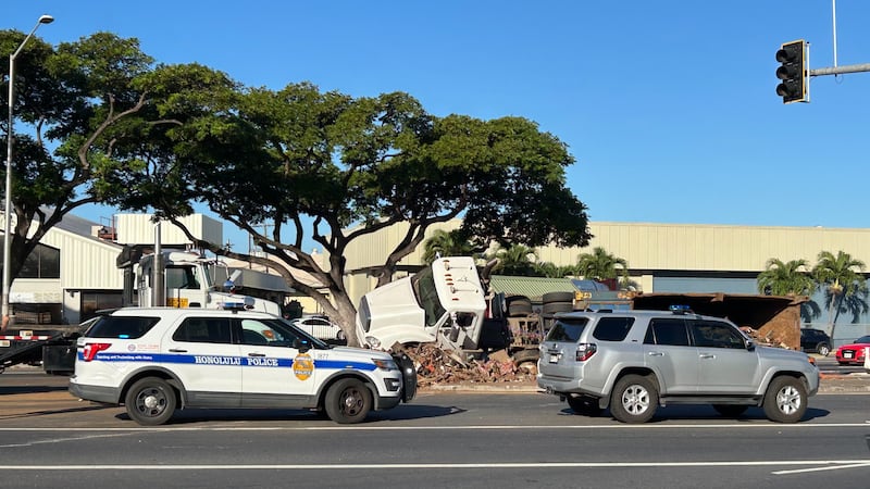 Photos from the scene show the truck’s load of metal scraps piled on the roadway.