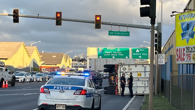 Overturned semi-truck at Sand Island intersection