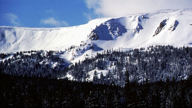 FILE - The sun shines onto Vasquez Cirque, new terrain for Winter Park Resort, Feb. 1997,...