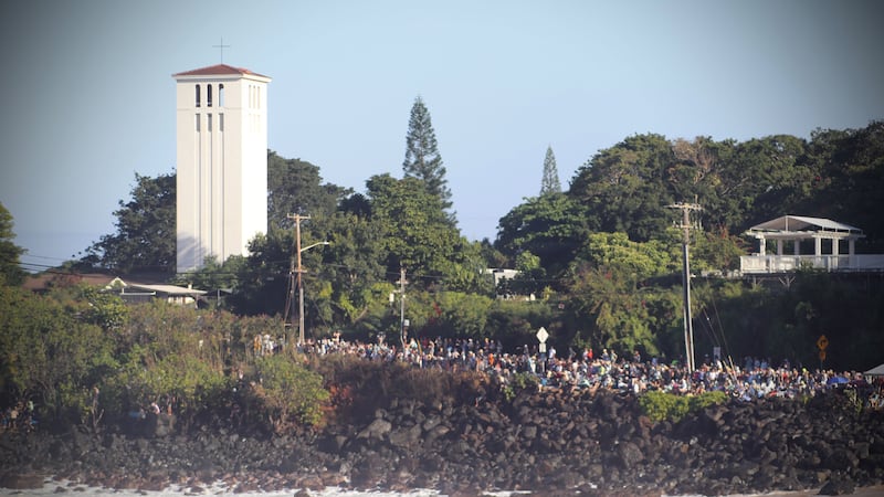 Thousands gather to watch the surfing competition.