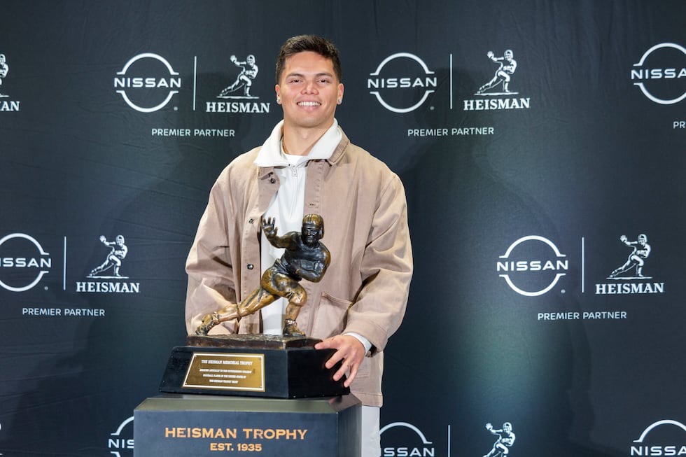 Heisman Trophy finalist Dillon Gabriel poses with the trophy during a college football media...