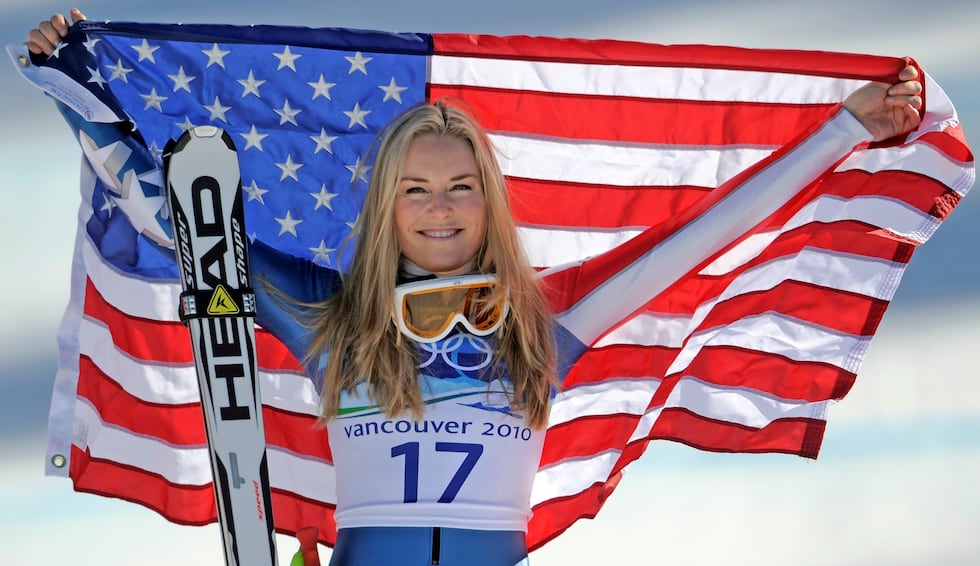 FILE - Bronze medalist Lindsey Vonn of the United States hold the Stars and Stripes during the...