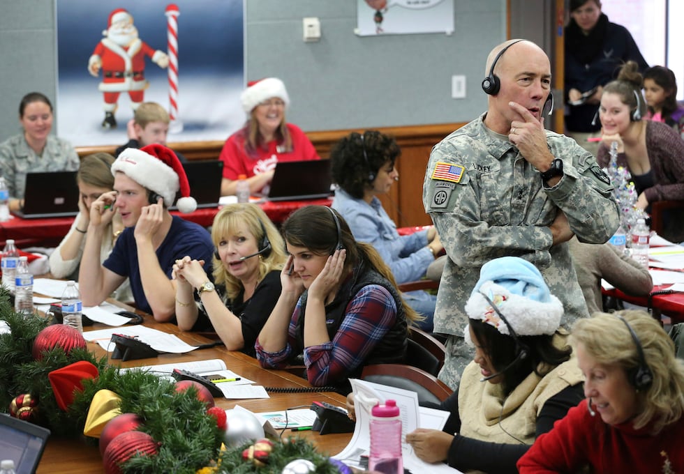 FILE - NORAD Chief of Staff Maj. Gen. Charles D. Luckey takes a call while volunteering at the...