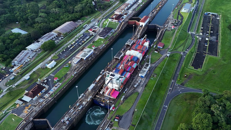 FILE - A cargo ship traverses the Agua Clara Locks of the Panama Canal in Colon, Panama, Sept....