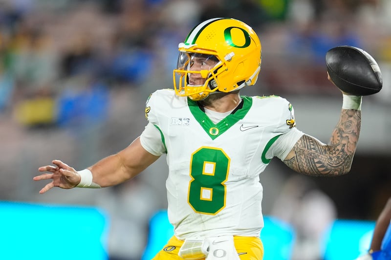 Oregon quarterback Dillon Gabriel (8) throws a pass during the second half of an NCAA college...