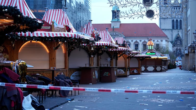 Police tape cordons-off a Christmas Market, where a car drove into a crowd on Friday evening,...