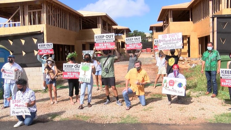 Residents protested the monster homes Sunday.