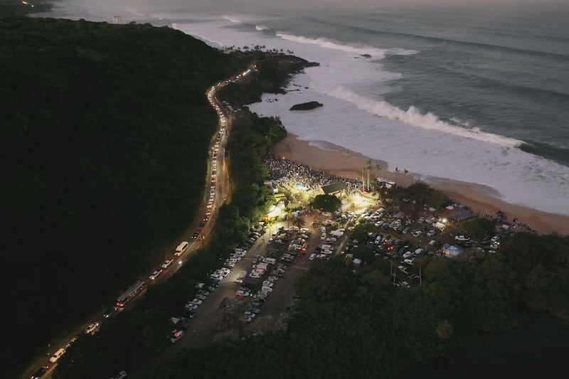 An aerial view of Waimea Bay as tens of thousands gather on Oahu's North Shore for the 2024...