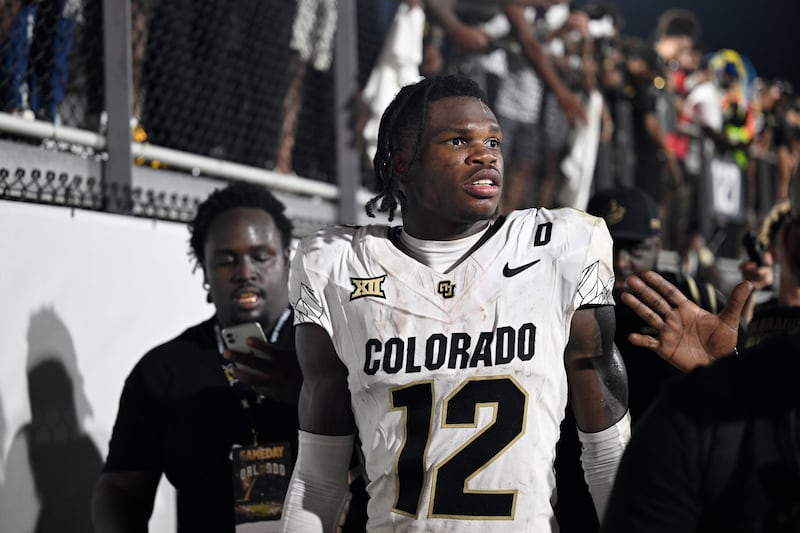 Colorado wide receiver Travis Hunter (12) leaves the field after an NCAA college football game...